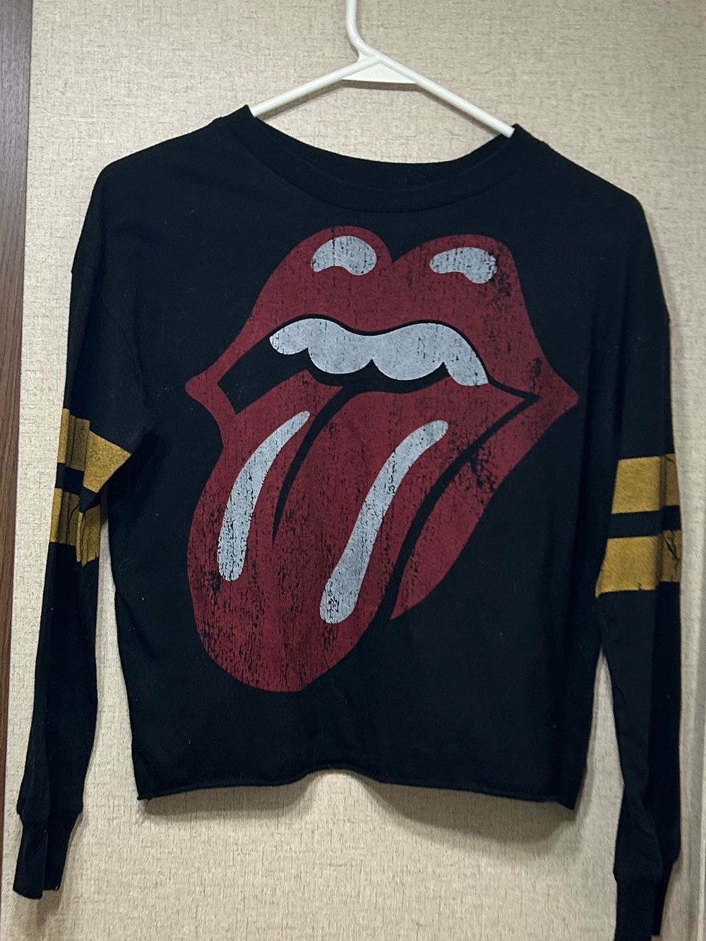 the Rolling Stones Black Long-Sleeve Tee with Red Tongue and Gold Stripes